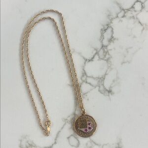 Elegant Gold Pendant Necklace with Pink Accents